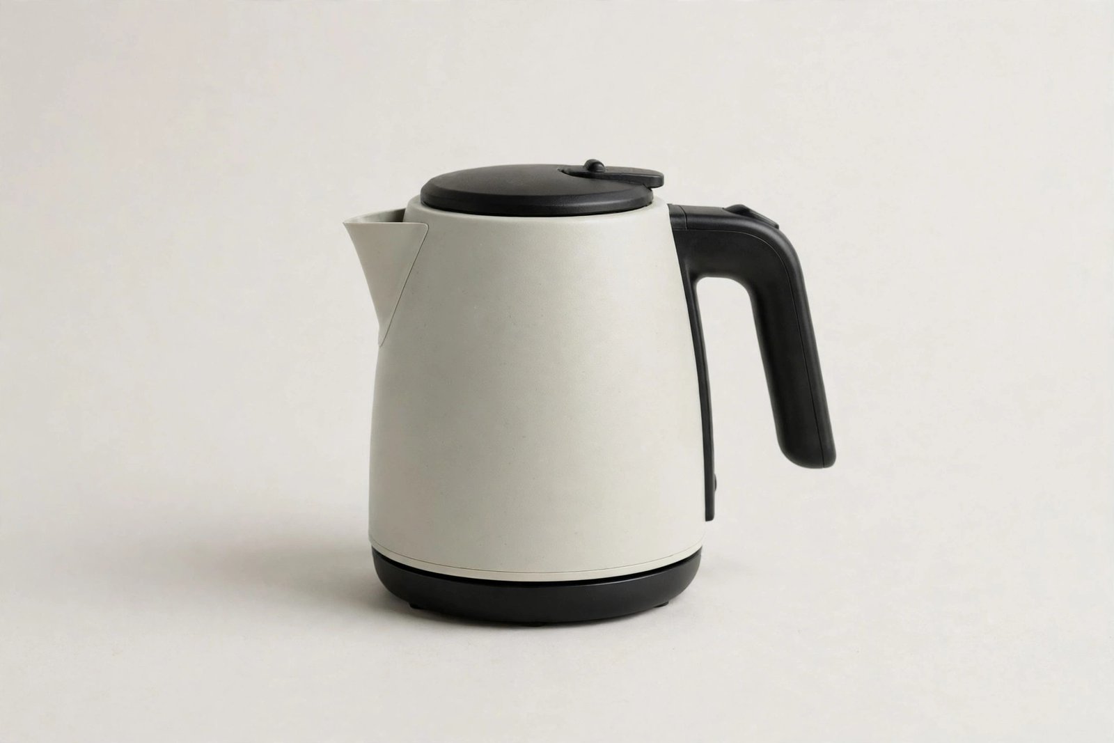 Compact electric kettle on a plain light background