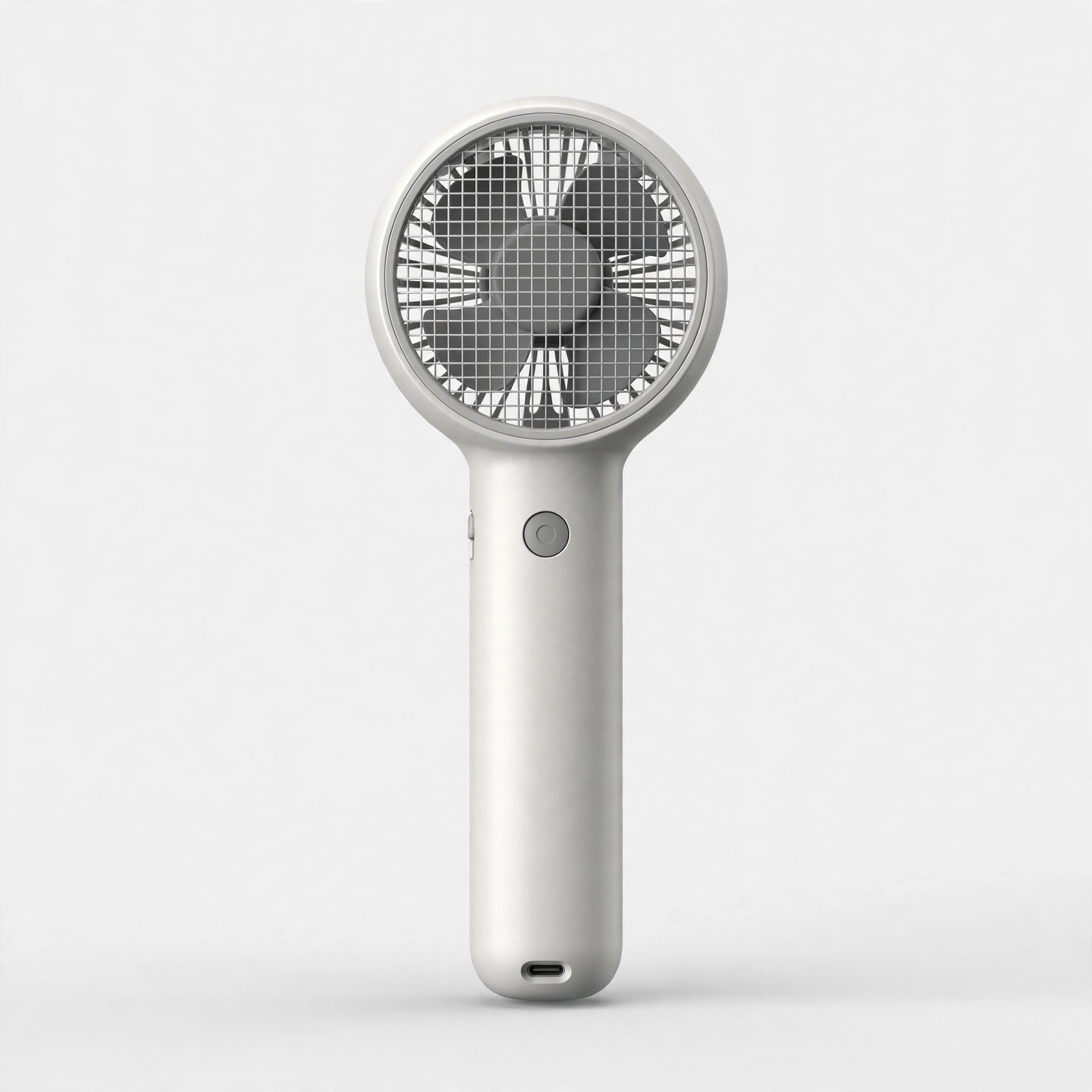 Handheld portable fan on a plain light background
